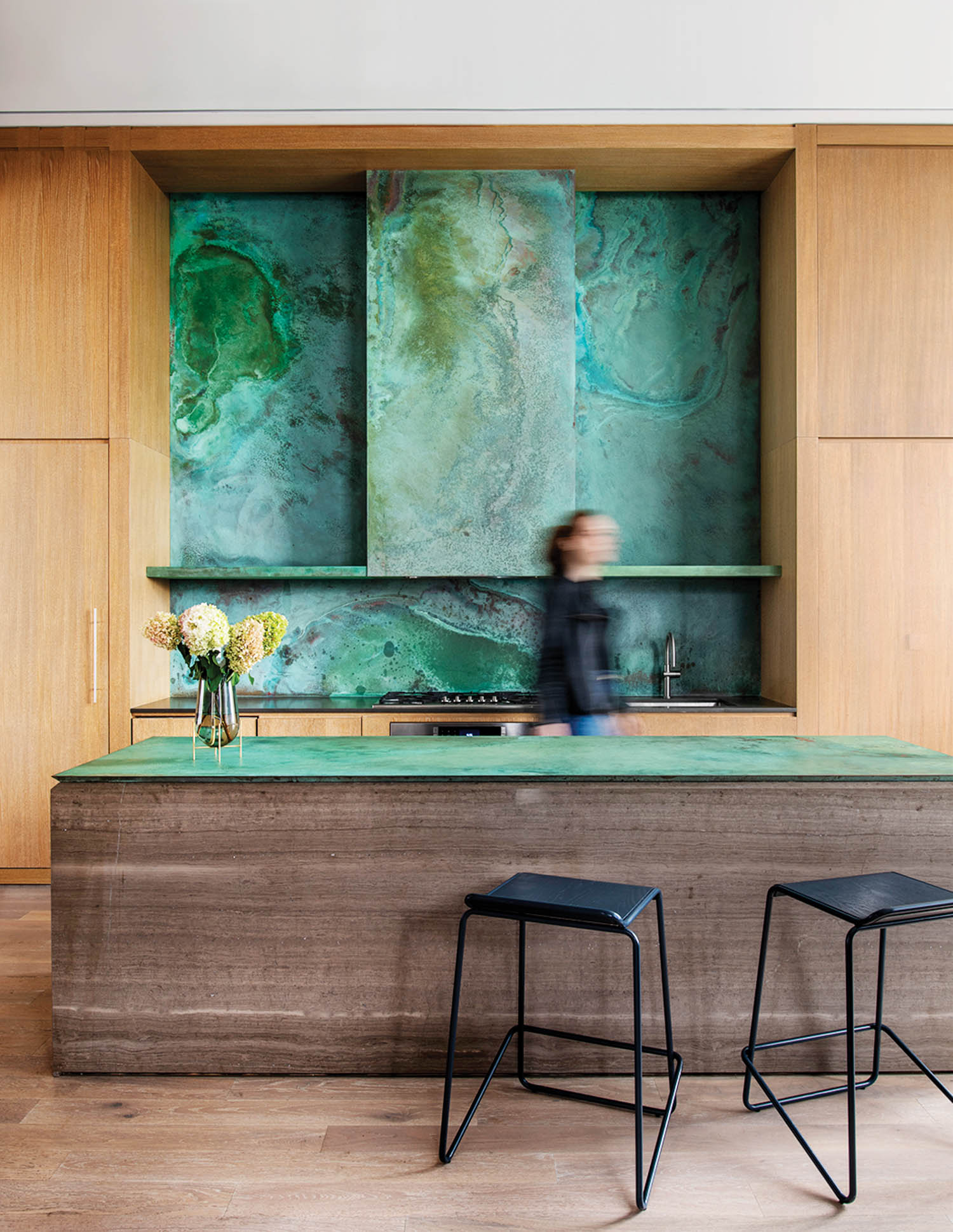 party room chef kitchen with green backsplash and green counters