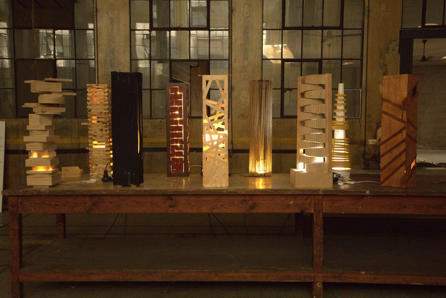 series of wooden lamps on a table