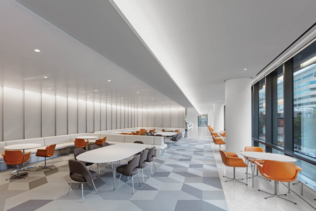 dining room with multiple tables and geometric carpeted flooring