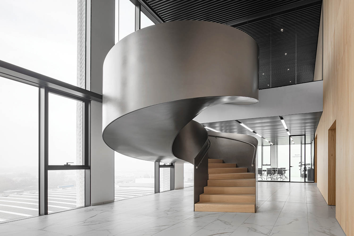 a spiral steel staircase inside the HQ