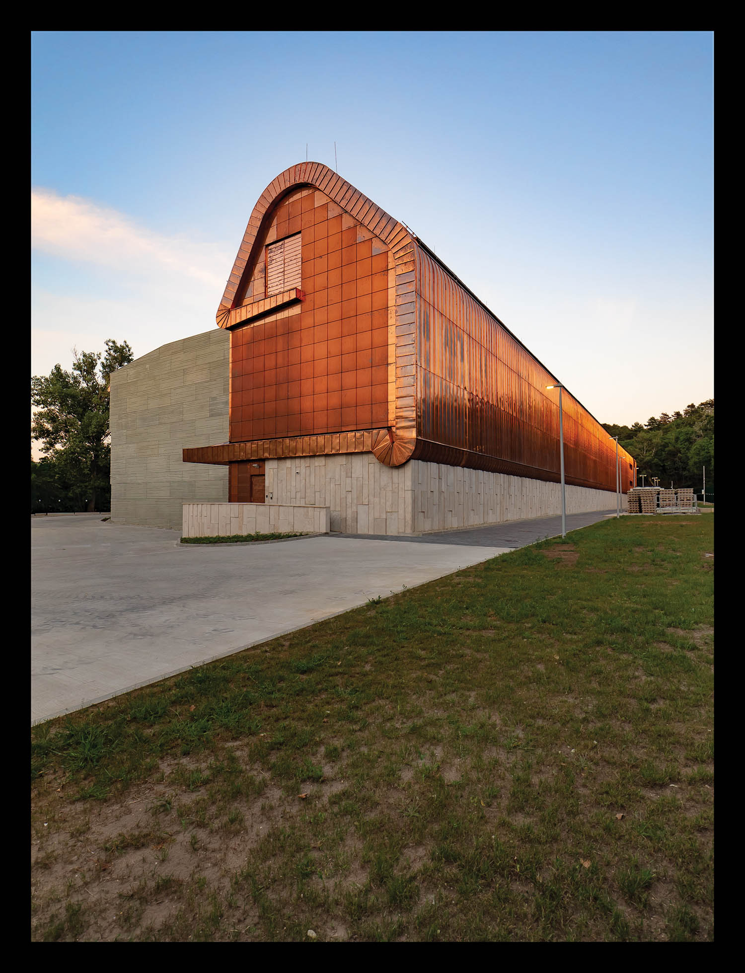 exterior facade of a library in a densely forested park