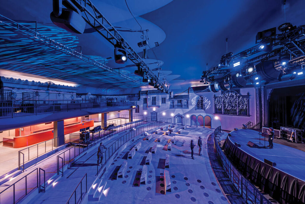 A concert hall surrounded by strange fake building facades.