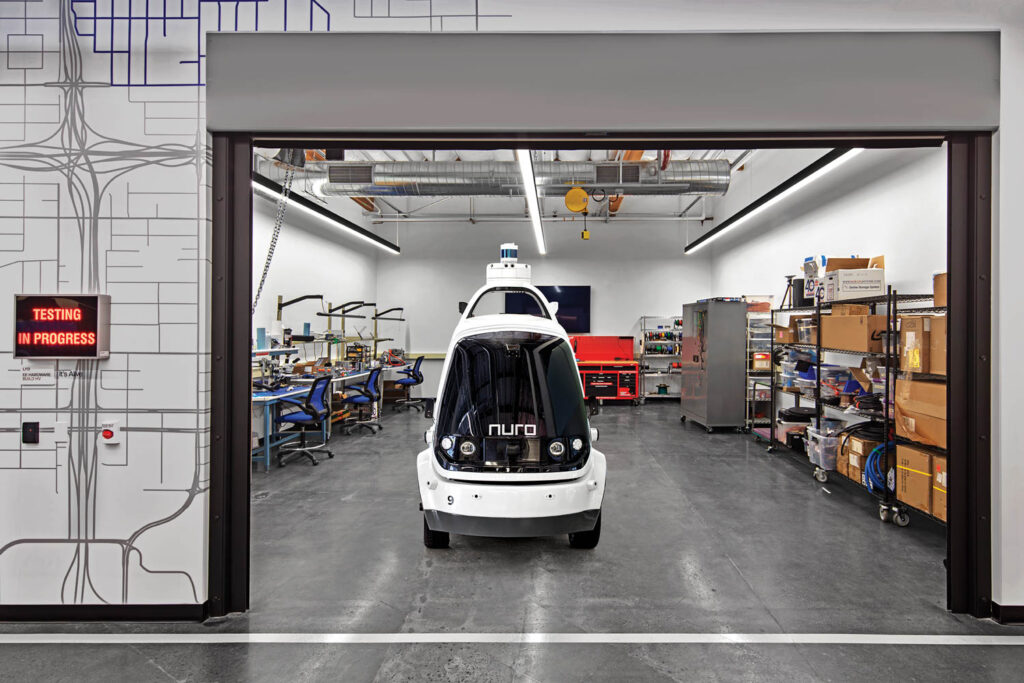 a white electric car in a testing lab