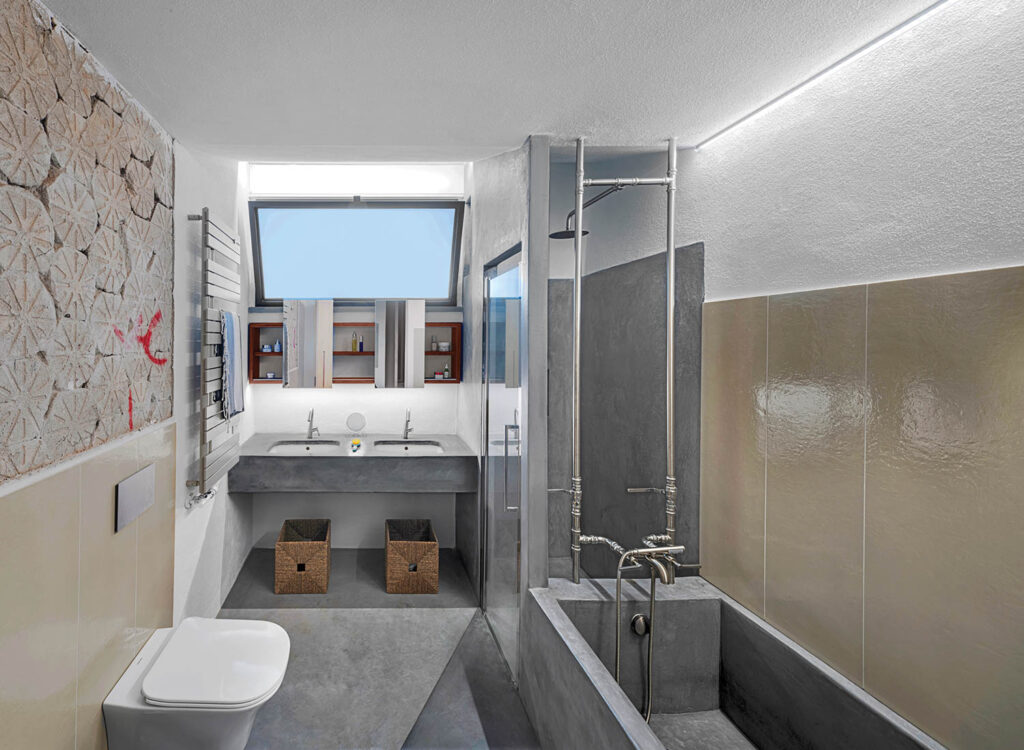 a grey bathroom in the master bedroom