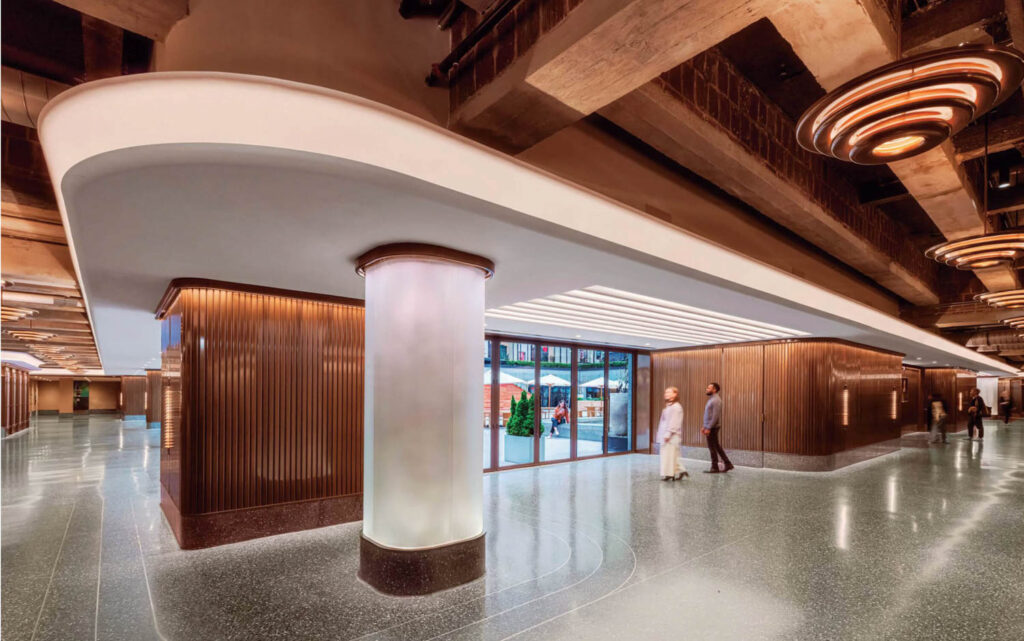 lobby of skating rink with lit columns and wooden paneled walls