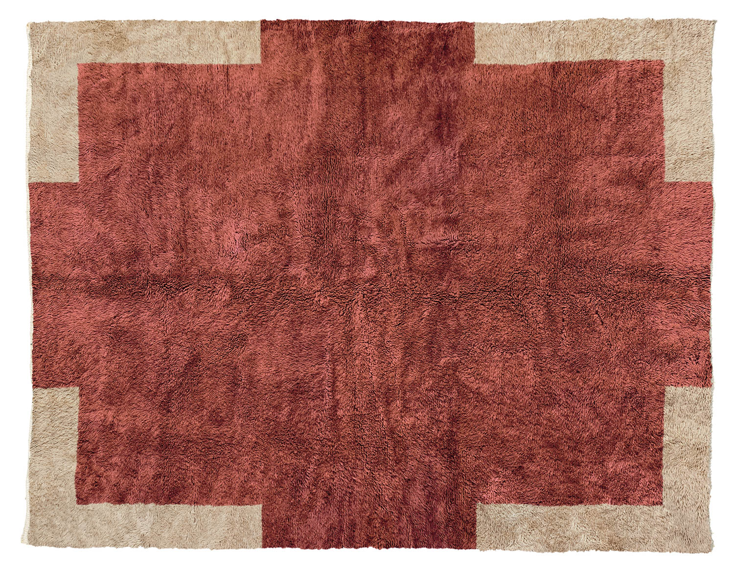 large tan rug with red squares