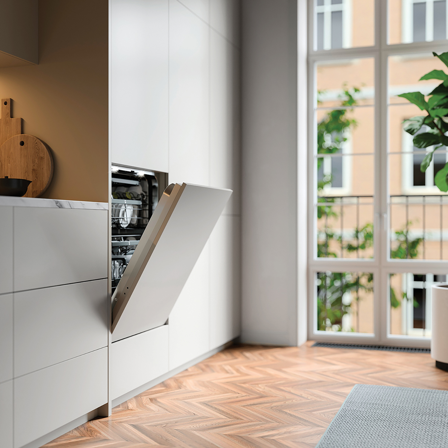 a kitchen with a sink and a pot of plants