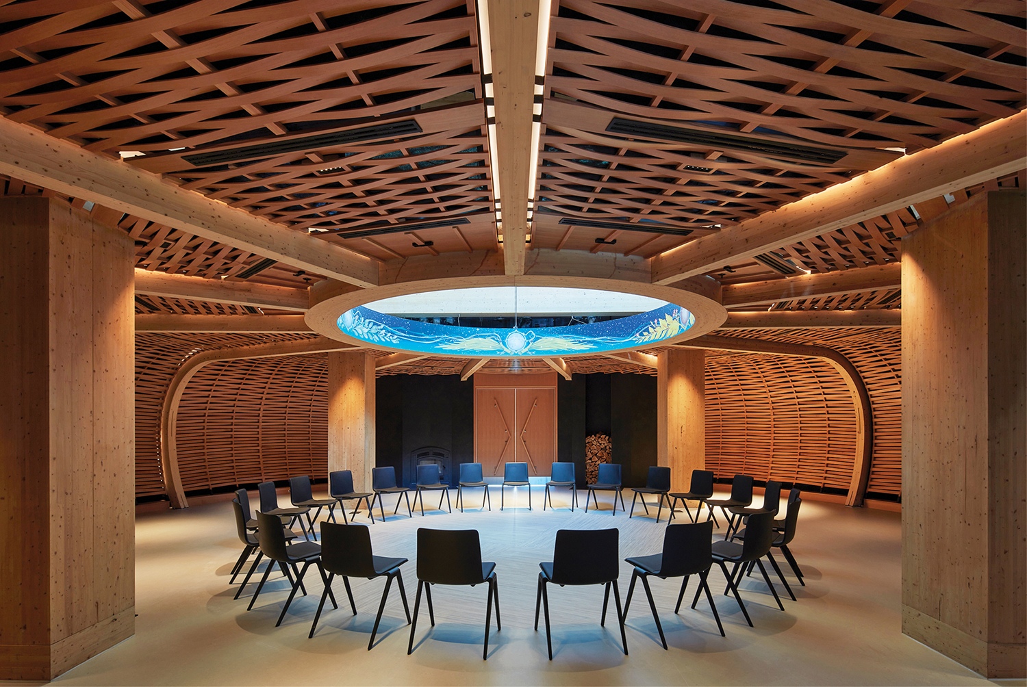 A room with a circular table and chairs