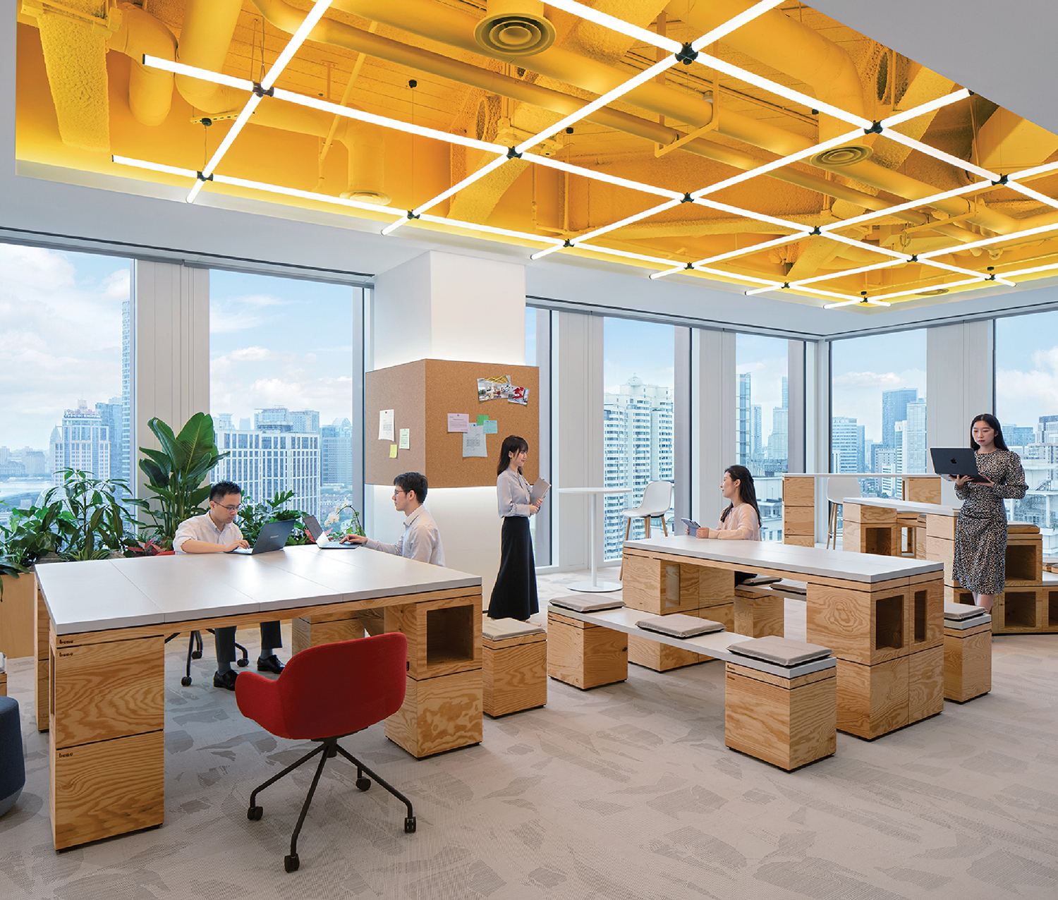 a large open office with a yellow ceiling