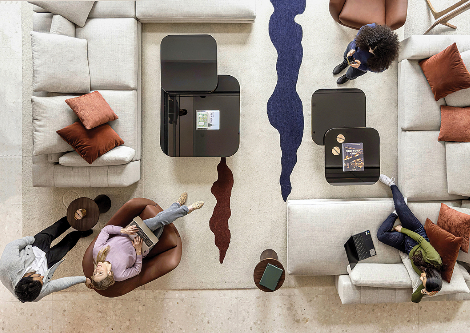 a group of people sitting on couches in a living room