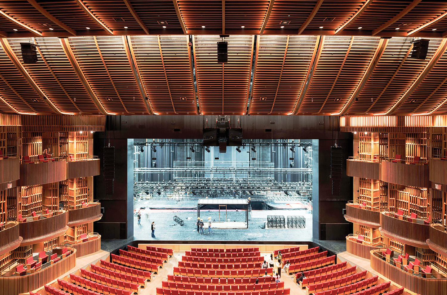 A large auditorium with rows of seats and a stage