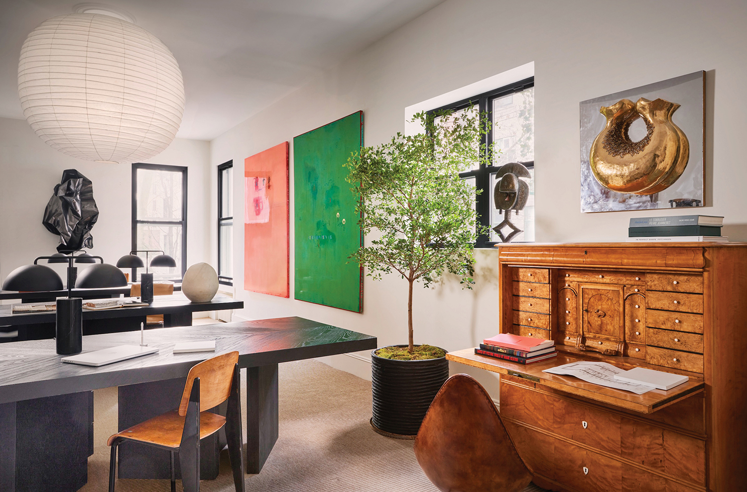 a desk with a plant in a pot