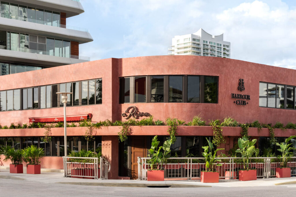 pink exterior of restaurant amidst buildings