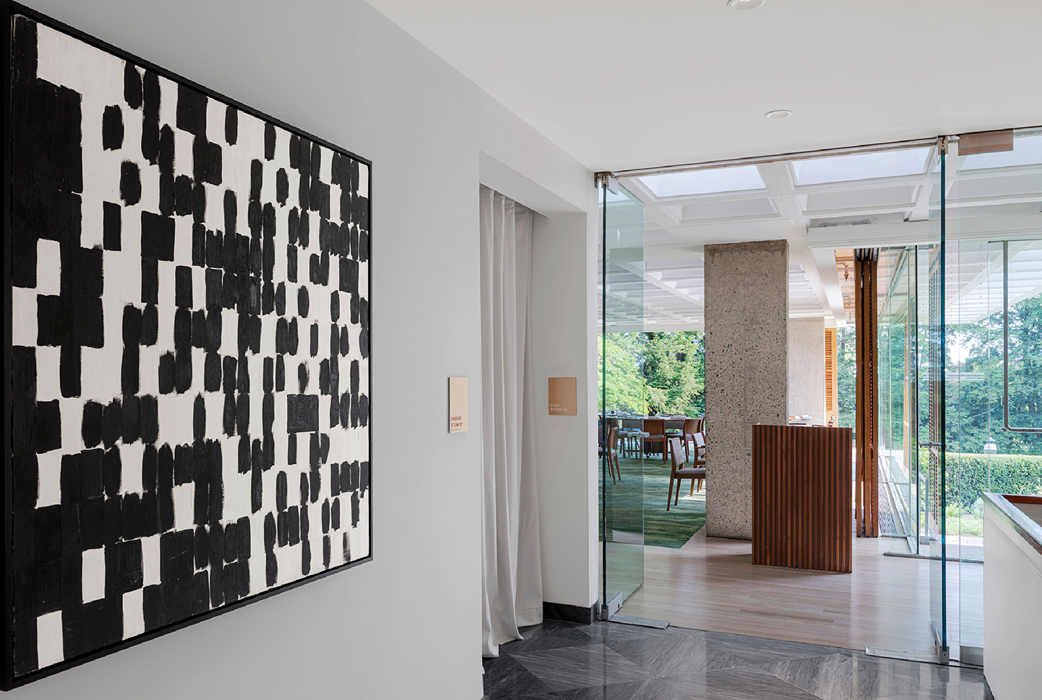 A black and white painting on a wall