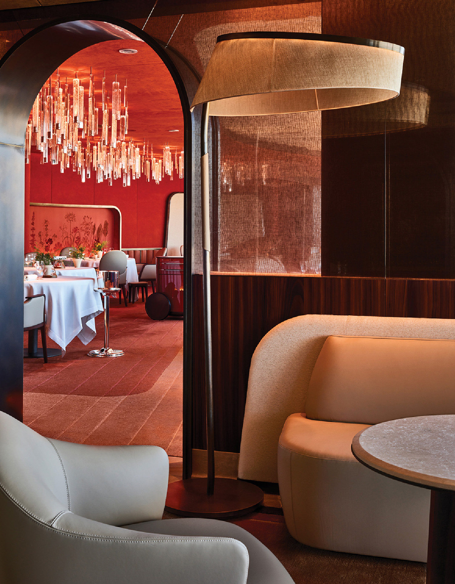 A room with a table and chairs and a chandel