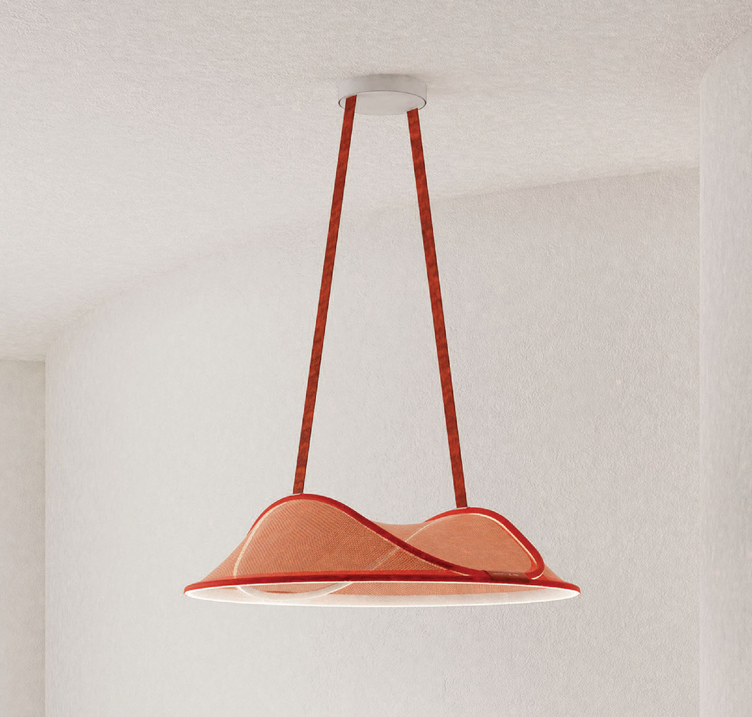A red and white lamp hanging from a ceiling