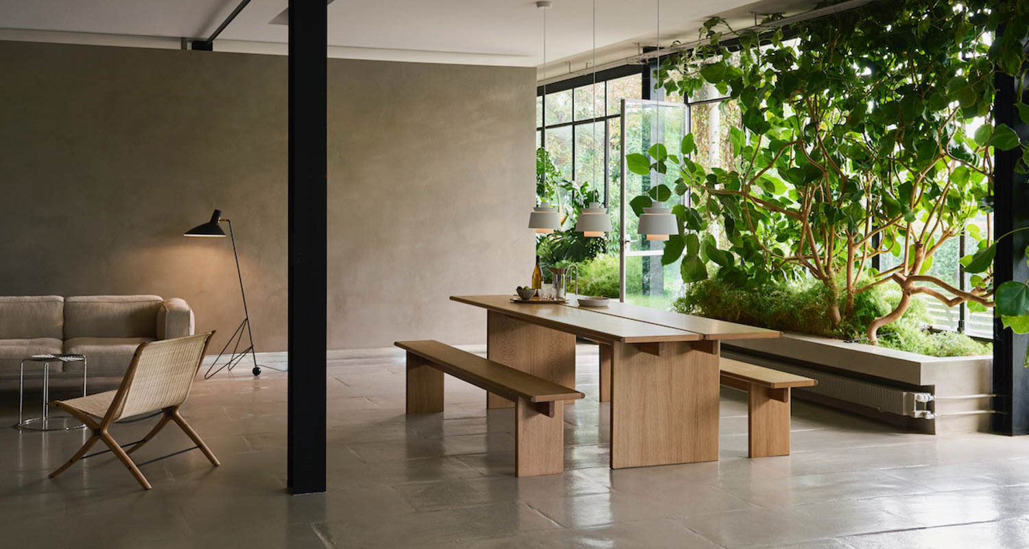 living room with wooden bench setup and lots of shrubbery at Stockholm Design Week 2025