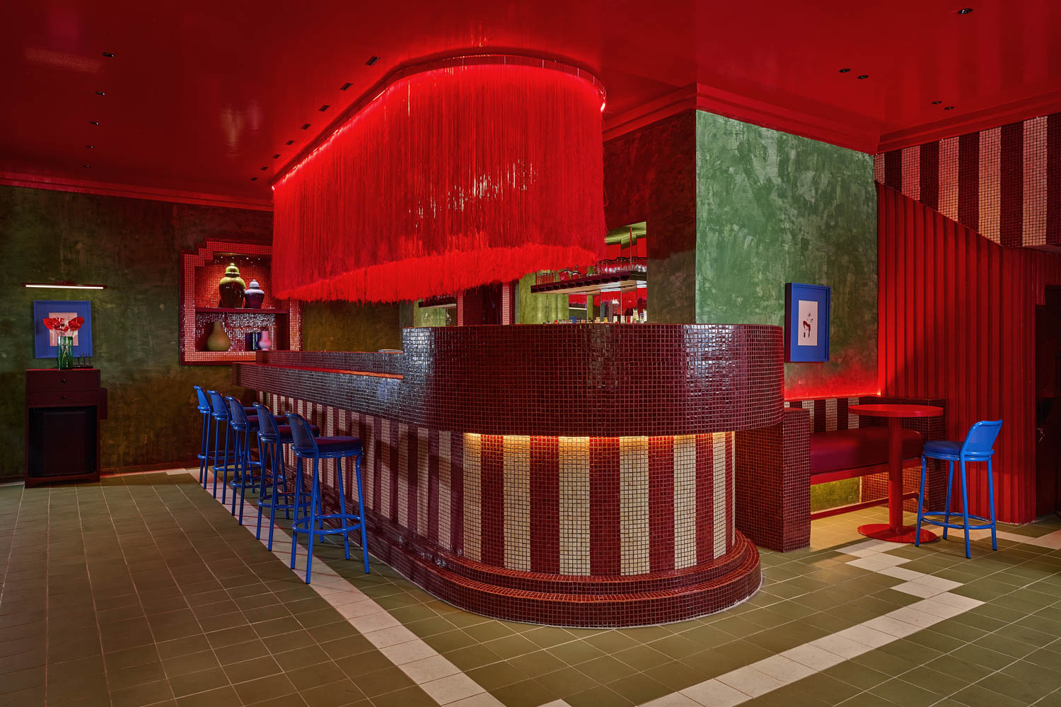 dark bar with moody red ceiling sculpture by Maye Ruiz