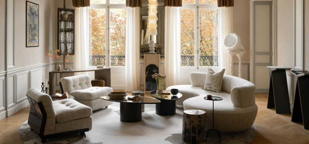 living room with bright white drapes, curved sofas and view of outdoors