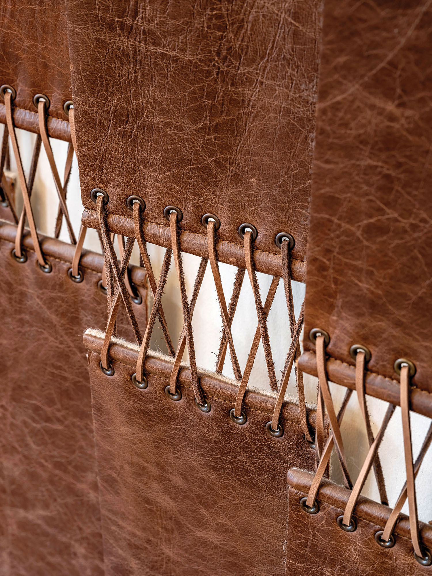 A brown leather binder with a white label