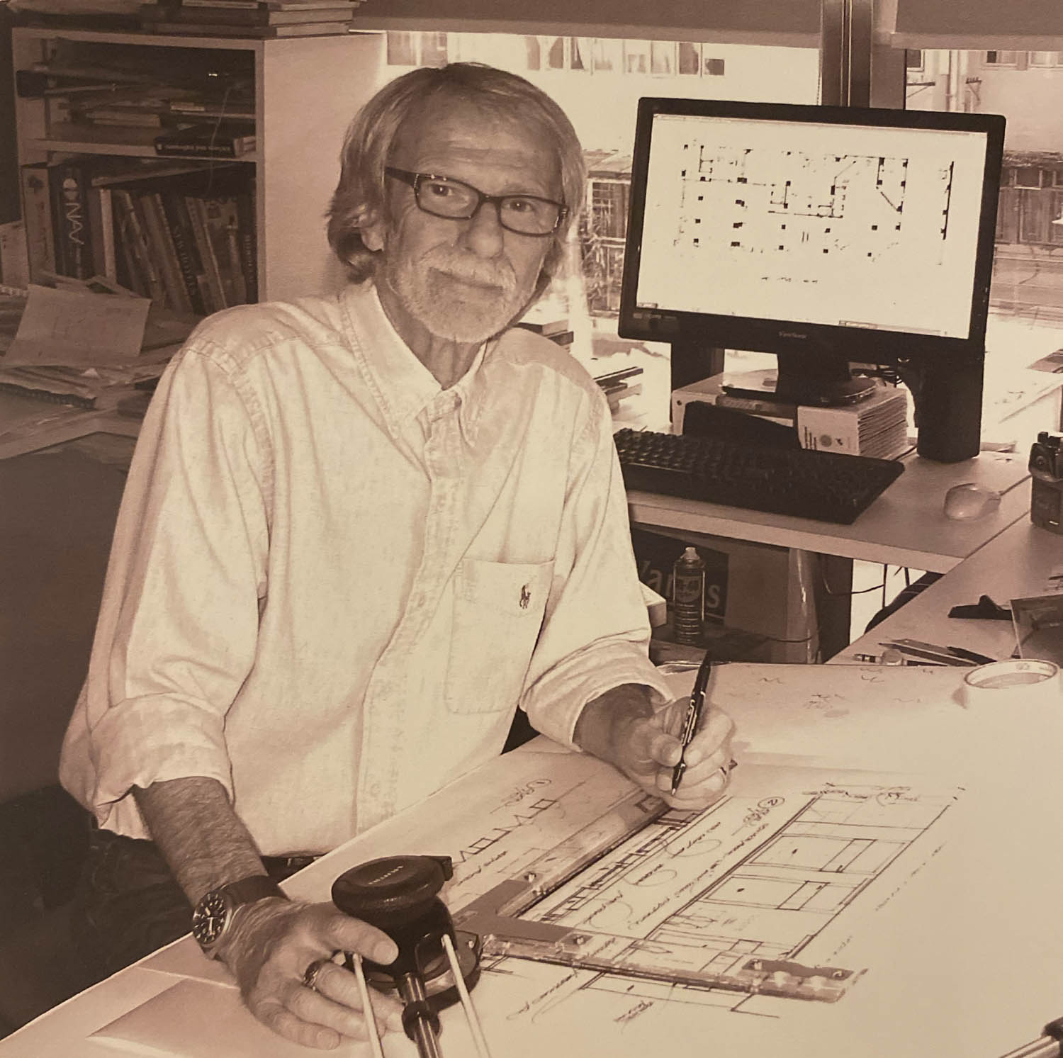 Van Maclean at drawing board