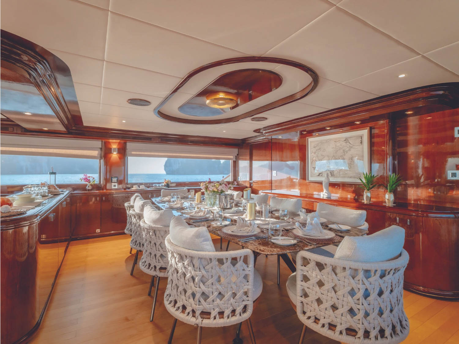 interior of yacht with dining chairs and wooden panels