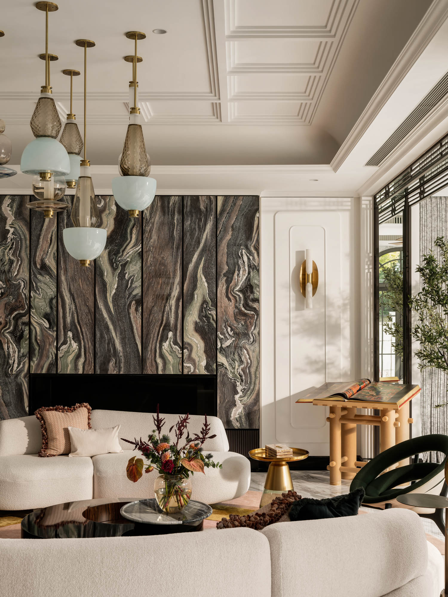 living room with white couches and black marble fireplace