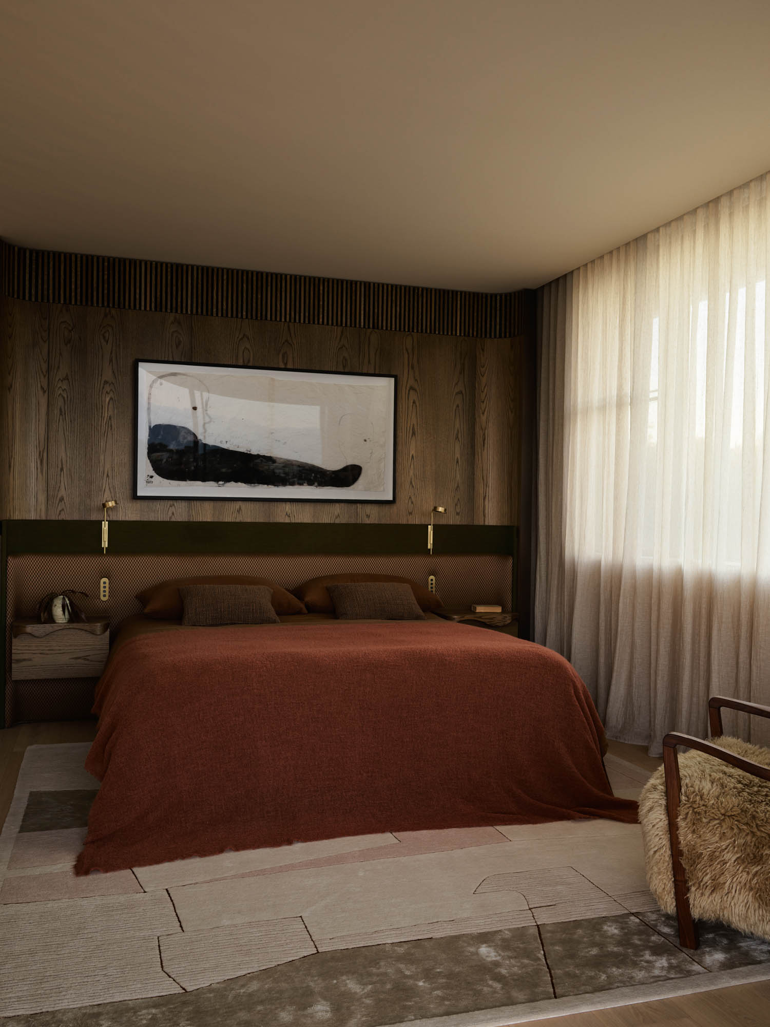bedroom with dark red sheets and large art piece hanging above bed