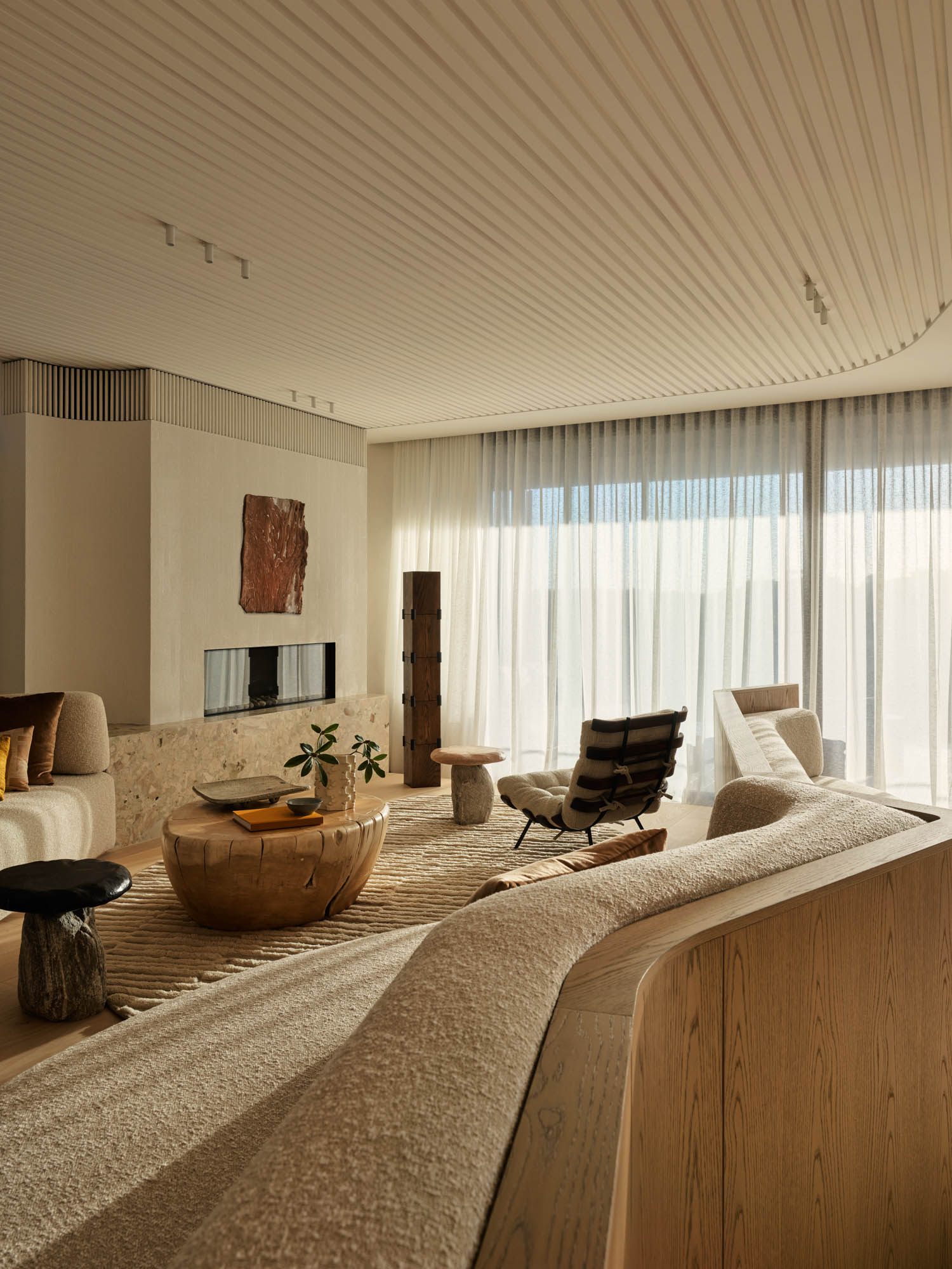 lounge area with ribbed ceiling and elevated podium area
