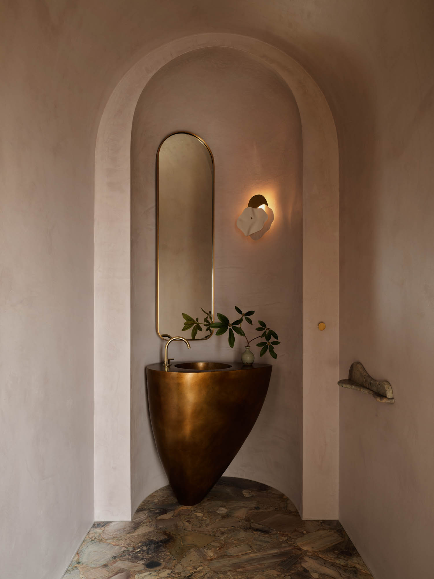 powder room with arched entryway and bronze basin