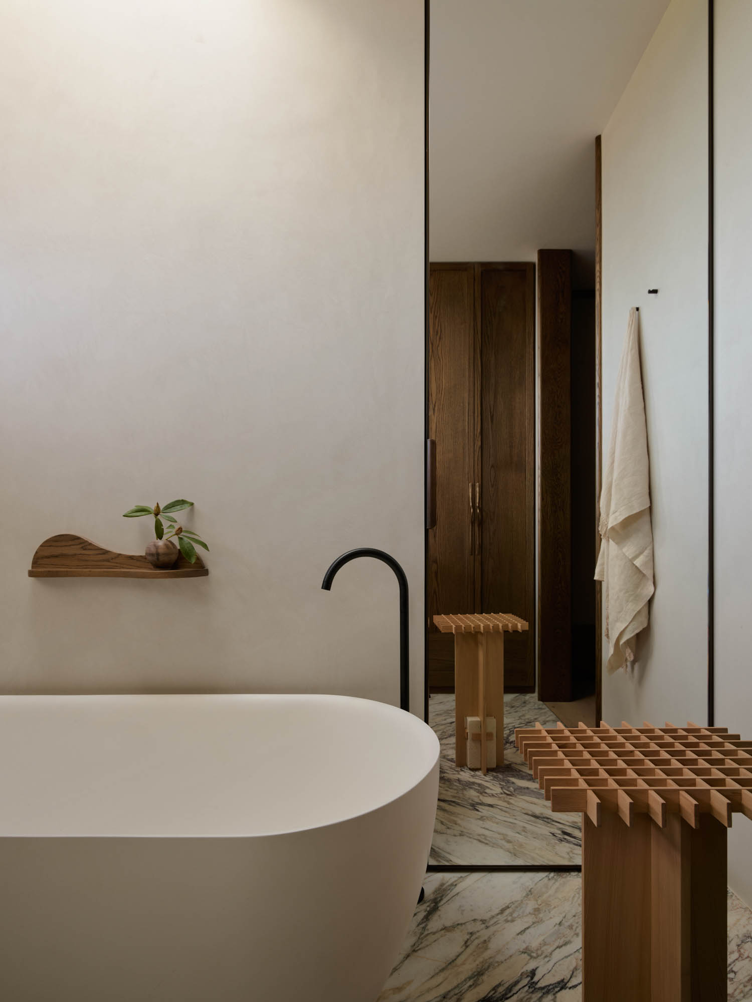 bathroom with freestanding bath and seating area