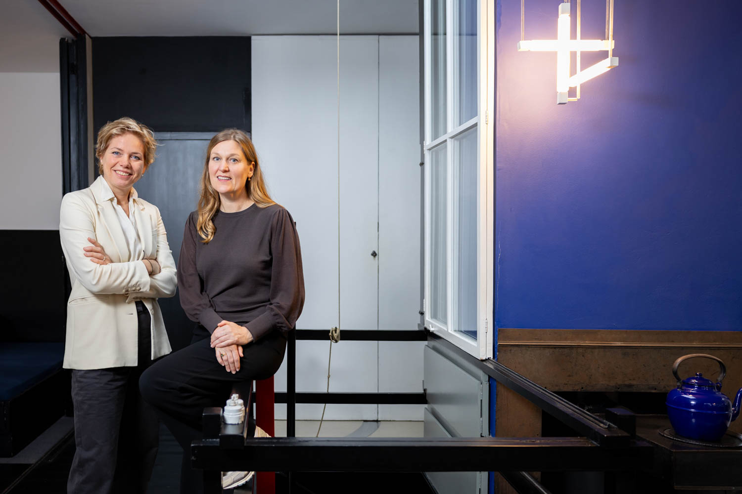 two women standing side by side