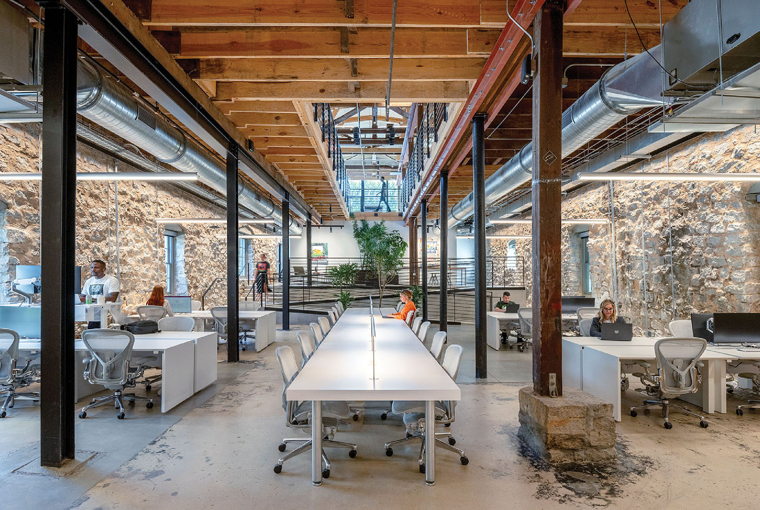A large open space with a long table and chairs