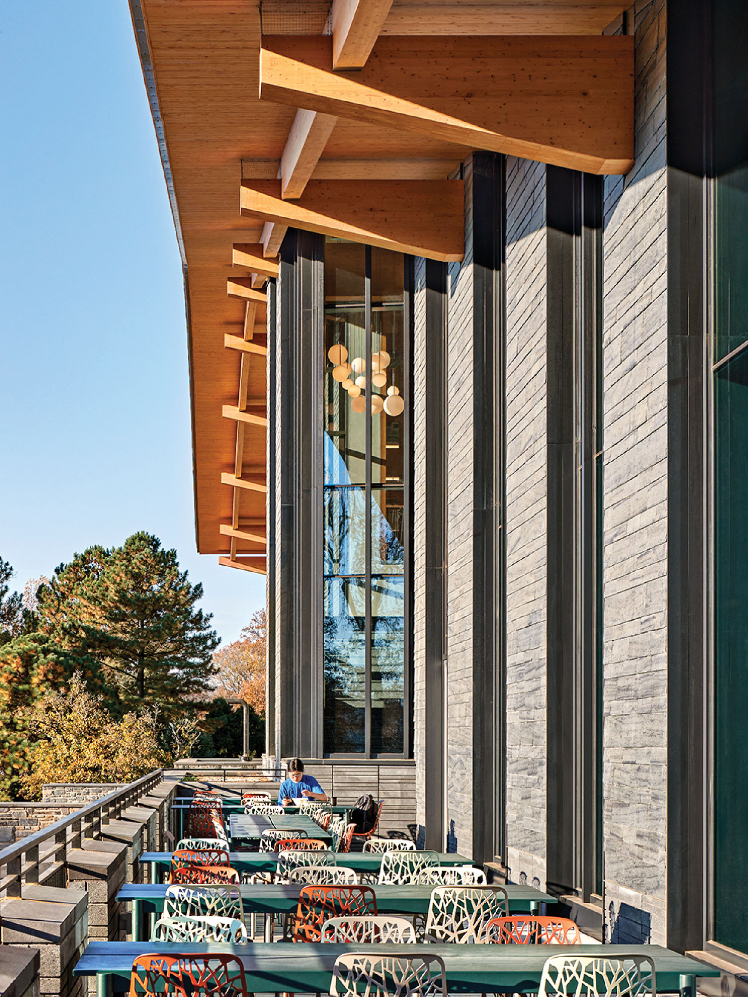 A row of tables and chairs on a patio