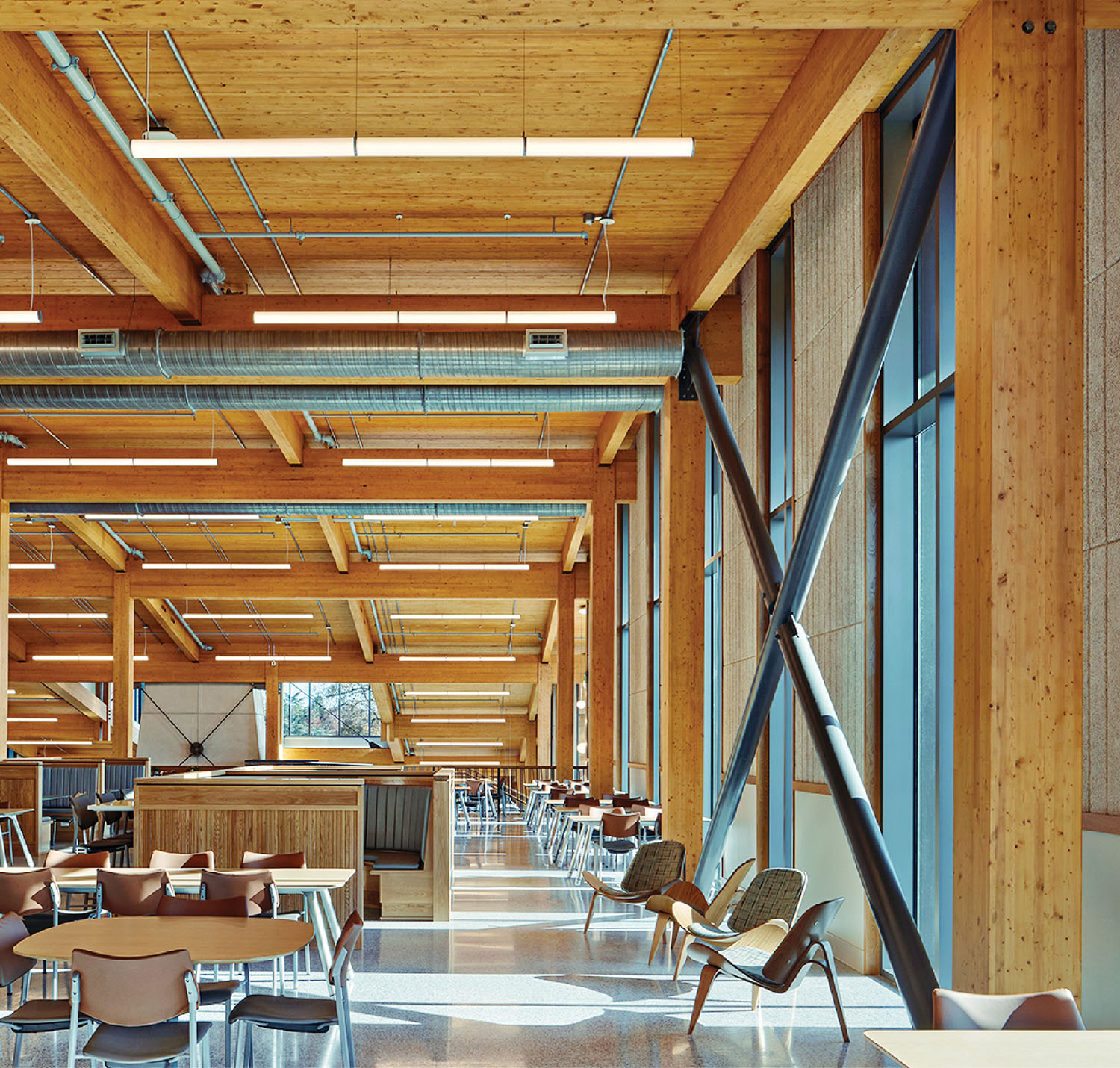 A large open space with a long table and chairs