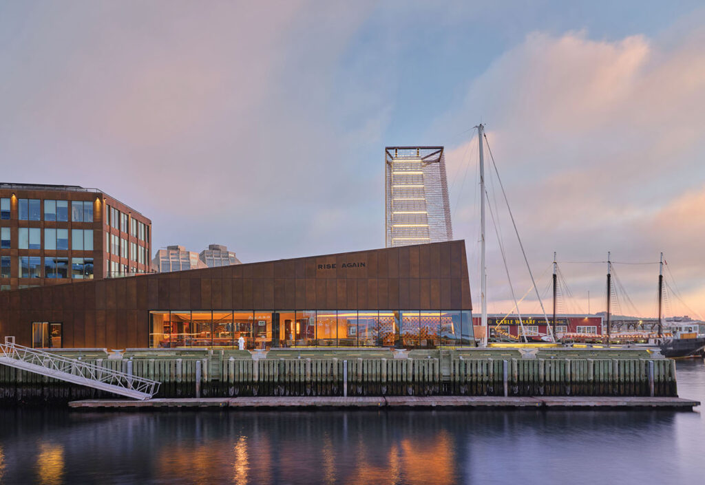 The waterfront at dusk with the city skyline in the background