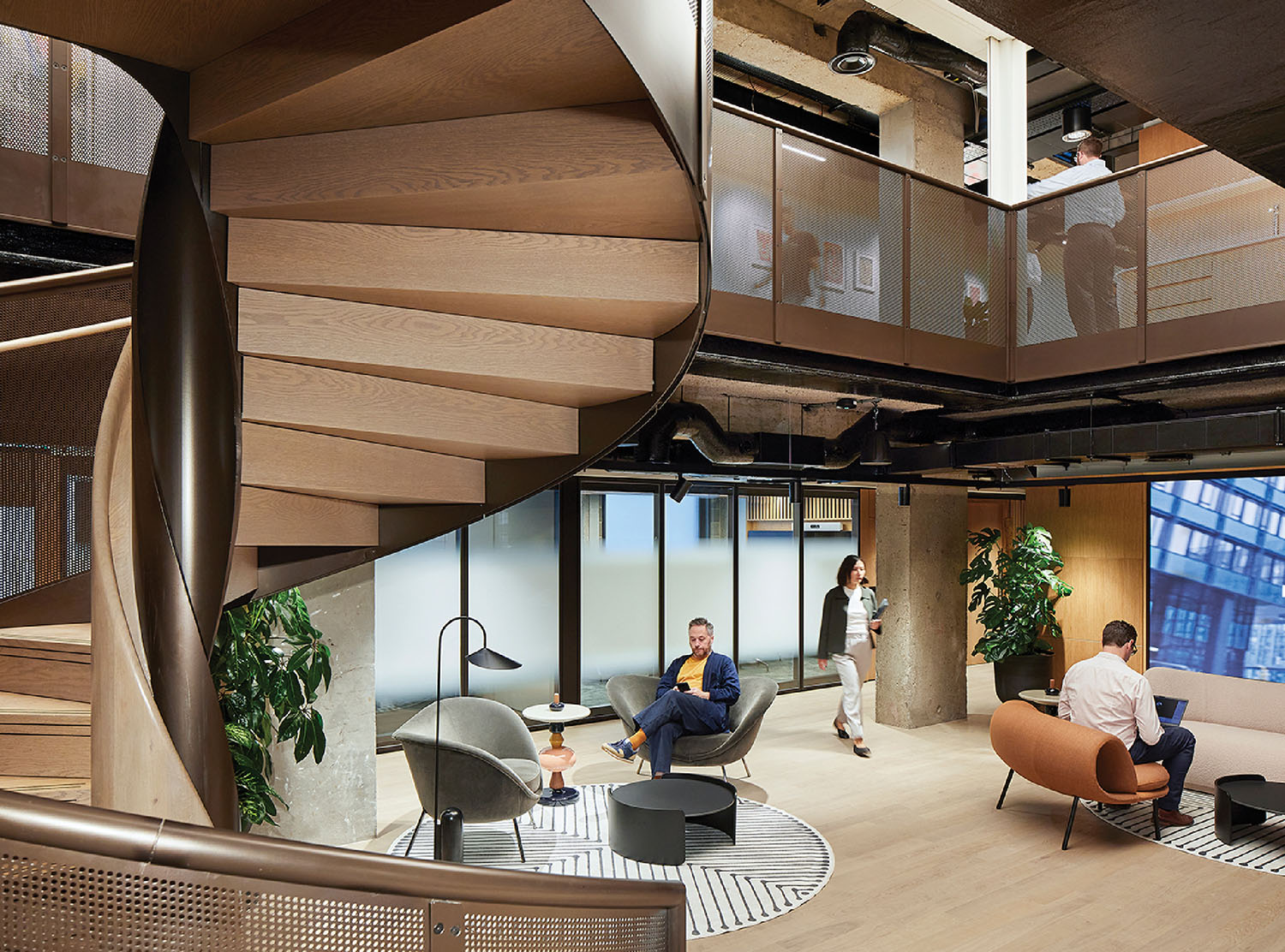 A large room with a staircase and a couch