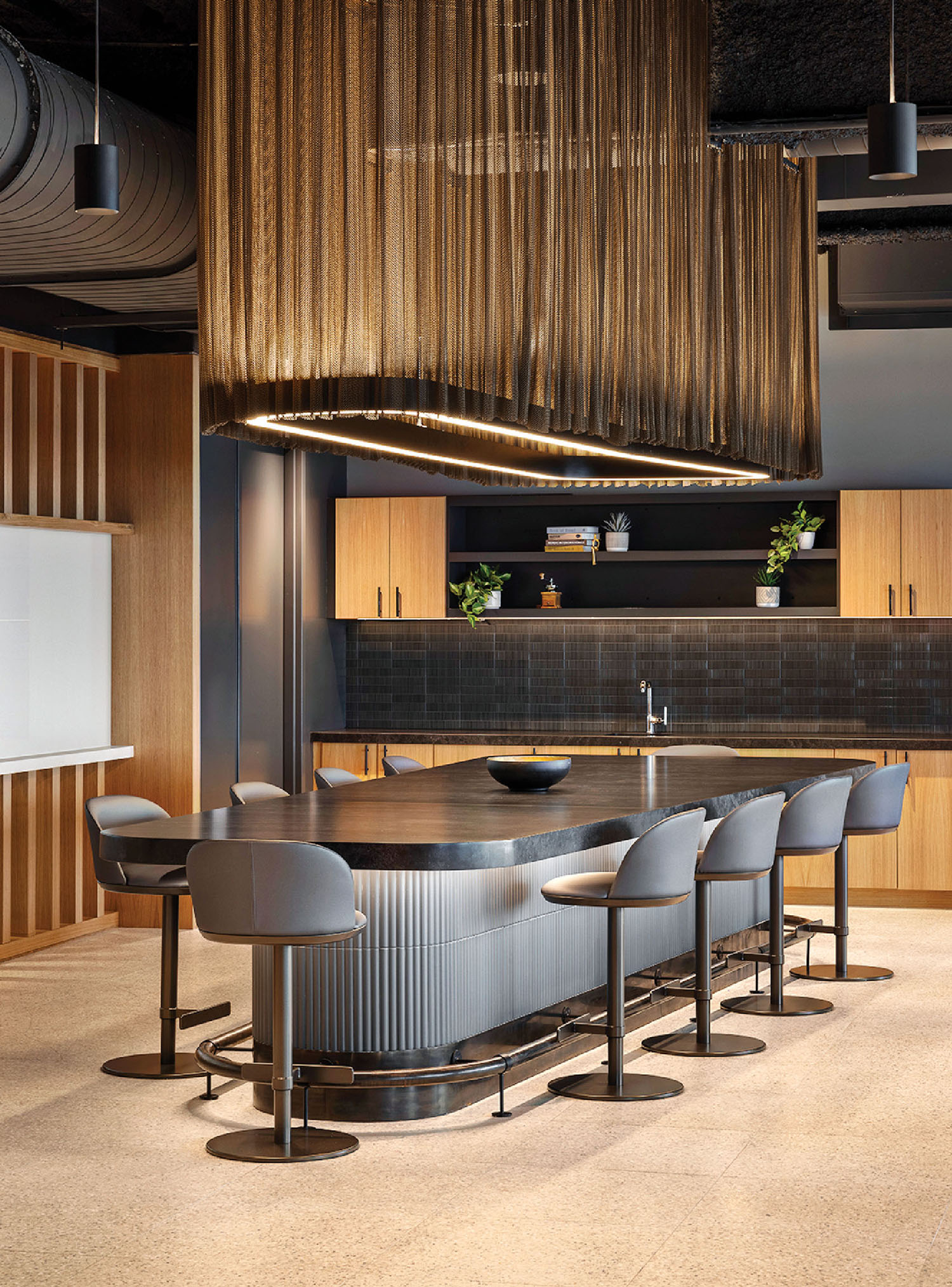 A kitchen with a bar and a dining table