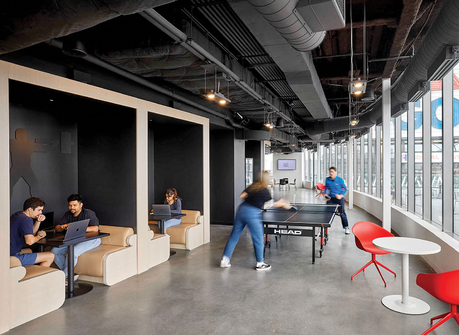 A group of people playing a game in a room
