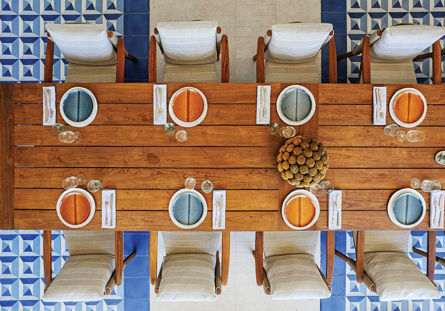 A table with a bunch of oranges on it