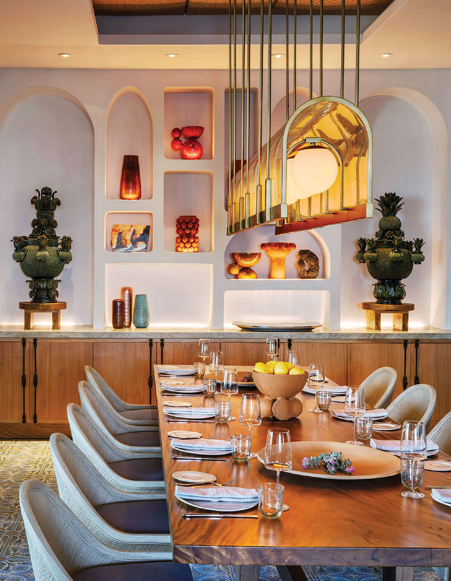 A dining room with a wooden table and chairs