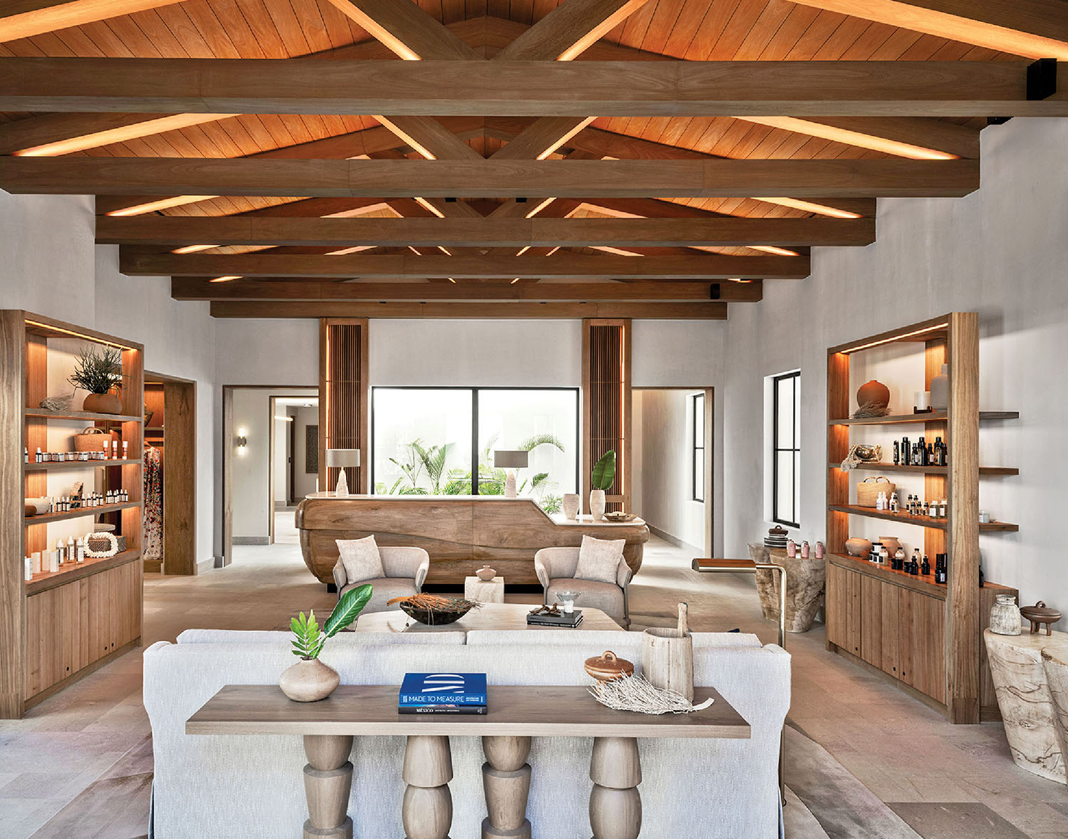 A living room with a large wooden ceiling