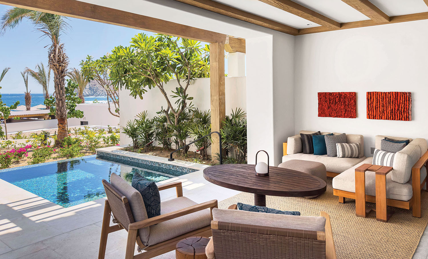 A living room with a pool and a patio