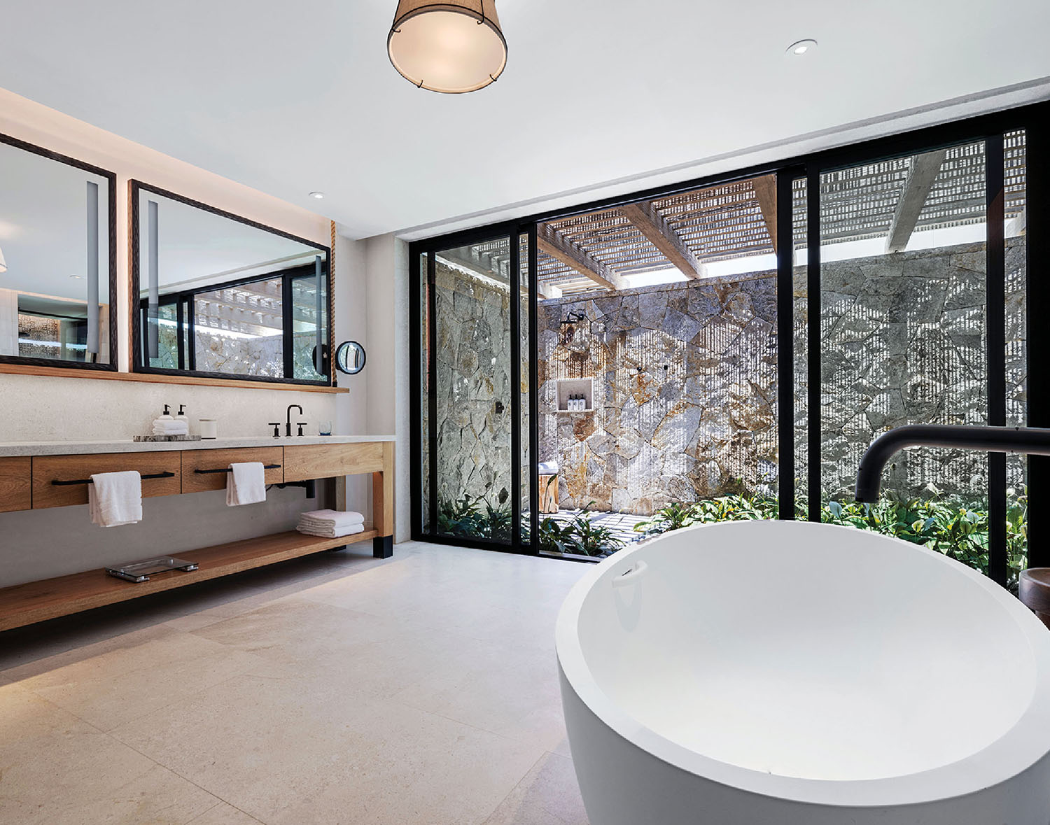 A large white bathtub in a bathroom