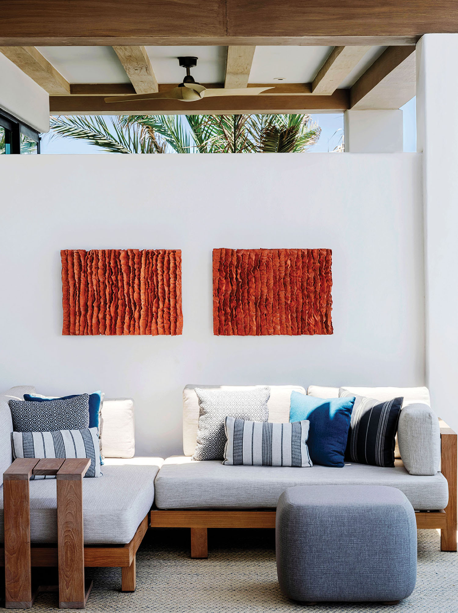 A living room with a couch and a large painting