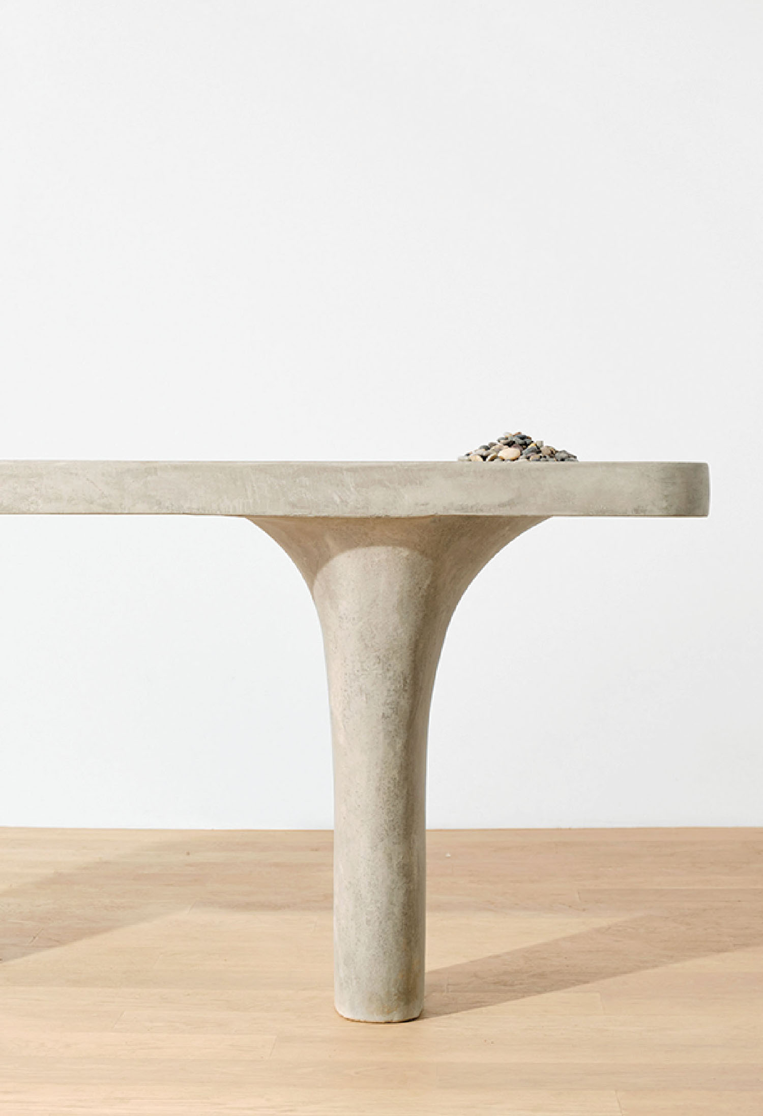 A concrete table with a bird on top
