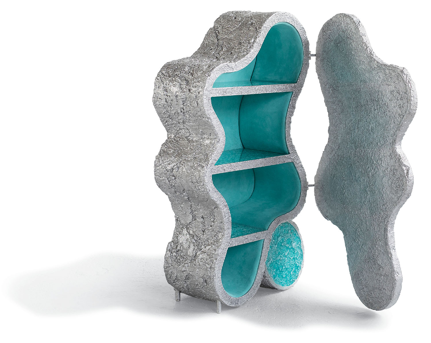 A sculpture made out of concrete and a turquoise colored glass