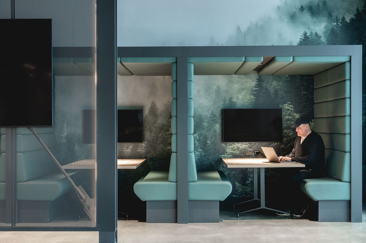A man sitting at a desk in a room