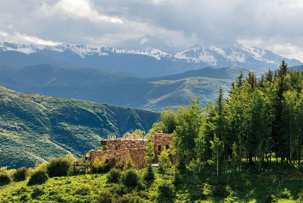 A mountain range with a small village in the fore