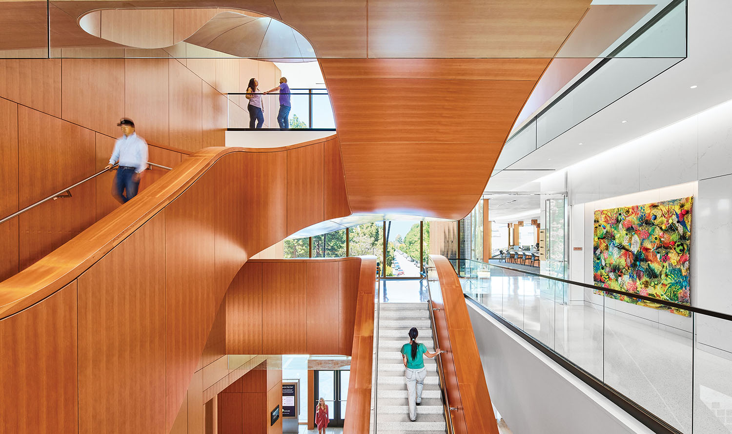 A man walking down a staircase in a building